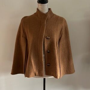 Chicos size 3 cape in a tan color & leopard print lining.  Some damage on collar